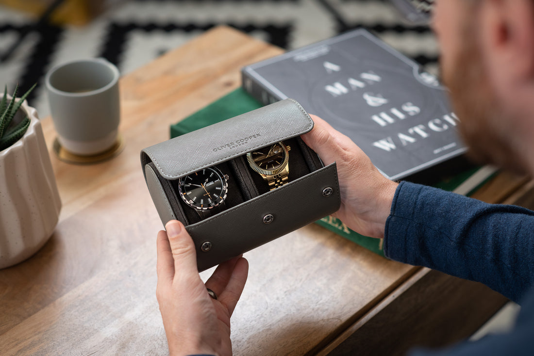 A photo of a man looking at his watch