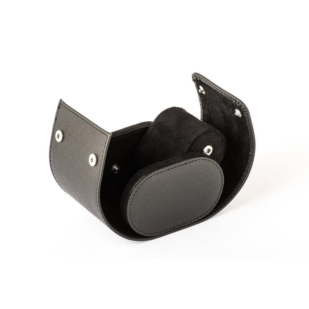 Black single watch holder revealing black suede lining and silver magnetic snap buttons.