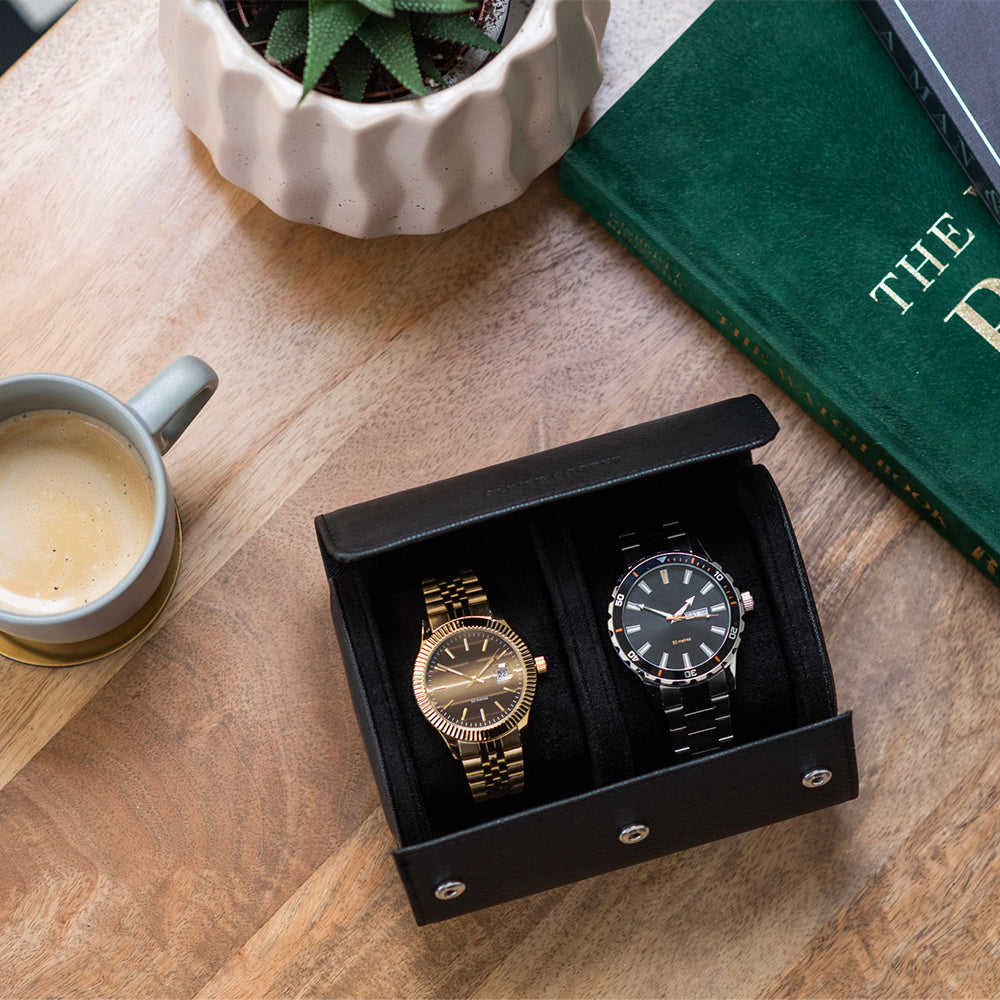 Top view of a double watch case in black leather, a luxurious alternative to traditional watch boxes for storing your timepieces.