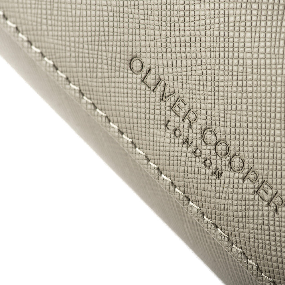 A Close-Up of Oliver Cooper London Branded Saffiano Leather watch roll case in grey