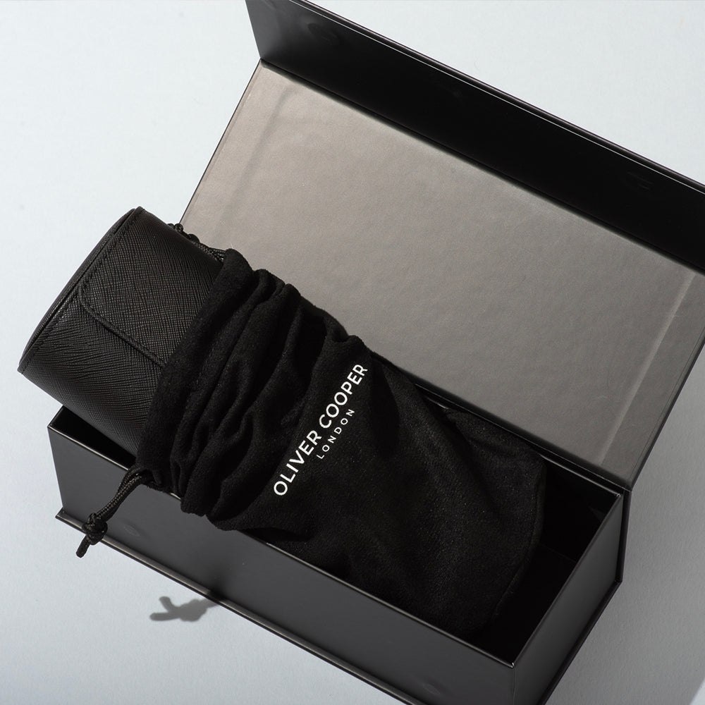 The watch roll presented in a suede bag and an elegant gift box